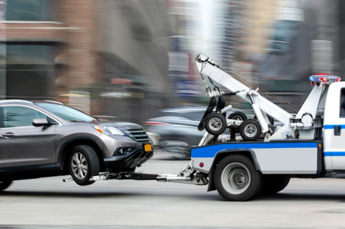 police department tow truck delivers the damaged vehicle